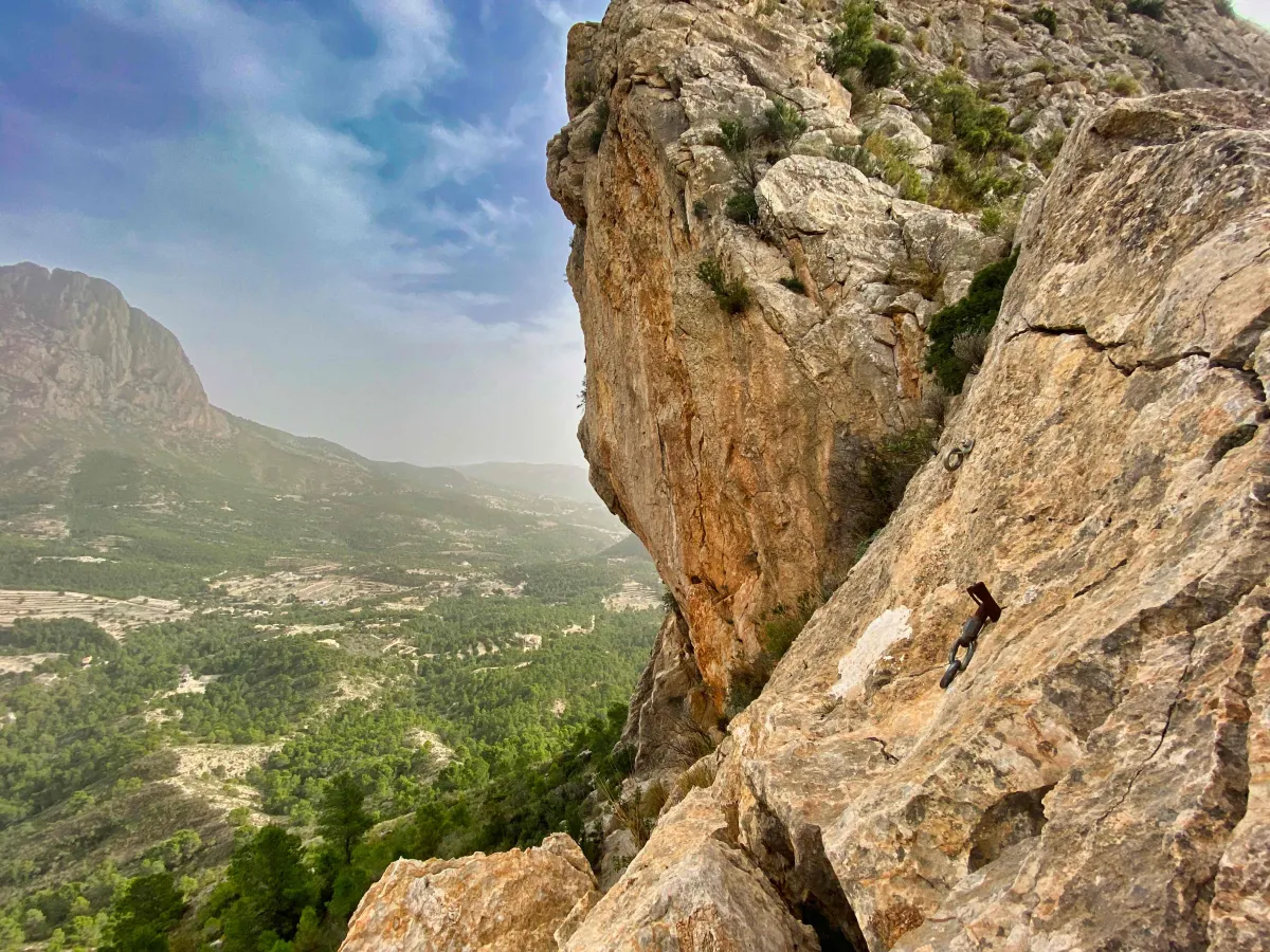 Overhanging rock and two bolts for emergency belay