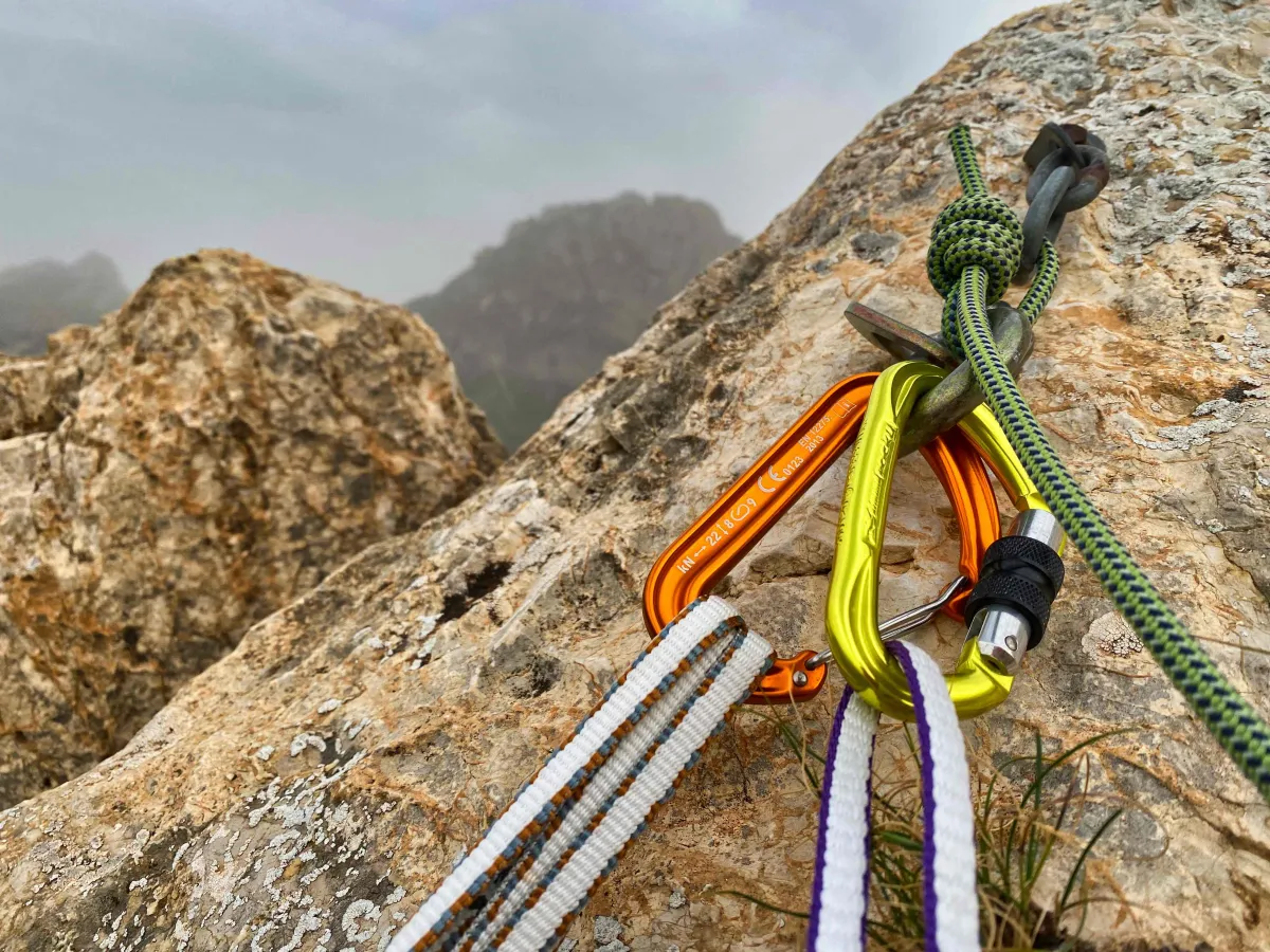 Alpine quickdraw and a locking carabiner attached to an anchor