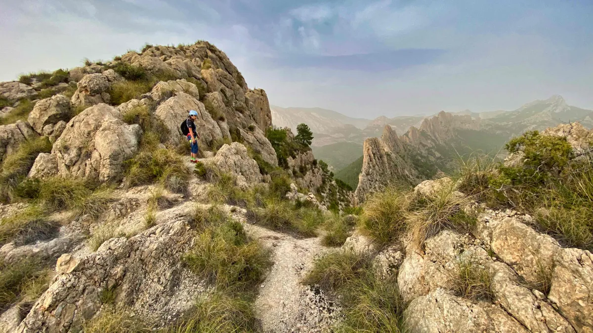 A climber staring at a white patch of gravel