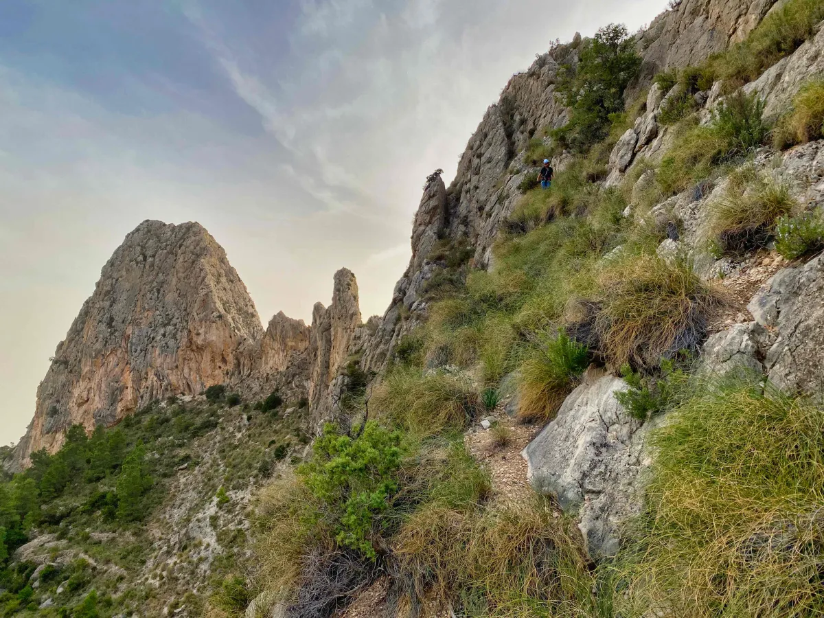 A steep slope underneath El Realet Three; castellated ridge in background