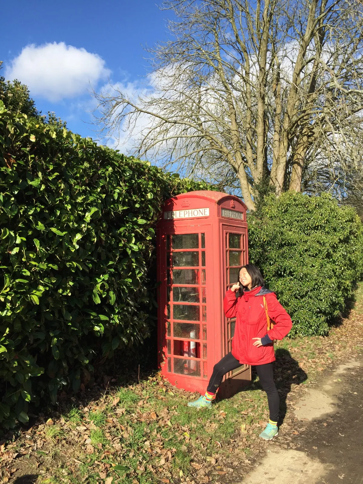 Wendy posing by a classic telephone box