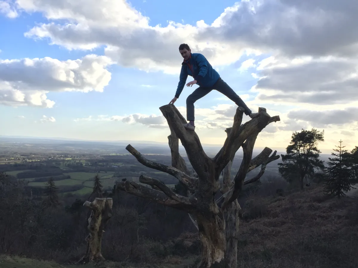 Maciek doing yoga on a tree